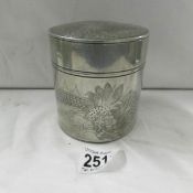 An engraved pewter tobacco jar.
