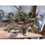 A large collection of brassware items including figures