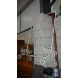 A wrought iron clothes stand