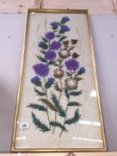 A gilt framed wall tapestry of flowers