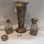 A silver vase together with 2 silver topped perfume bottles (one top a/f).
