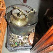 A box of brass and copper ware.