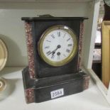 A Victorian black slate mantel clock.
