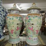 A pair of oriental lidded jars/vases.