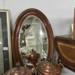 A nice quality oval framed bevel edged mirror.