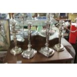 A pair of good quality silver plate candelabra and a pair of silver plate candlesticks.