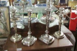 A pair of good quality silver plate candelabra and a pair of silver plate candlesticks.
