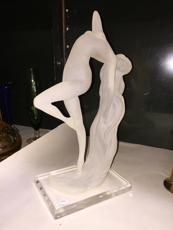 A modern figure of a nude arched lady