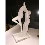 A modern figure of a nude arched lady