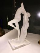 A modern figure of a nude arched lady