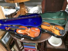 2 violins in cases
