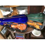 2 violins in cases