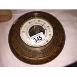 An oak aneroid barometer