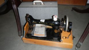 A cased Singer sewing machine