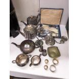 A box of silverplate including teaset, cutlery etc.