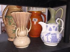 4 jugs and a vase including Barum, Barnstaple, Beswick etc.