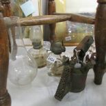 2 glass hand oil lamps with chimneys and a brass blow lamp.