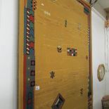 An amber patterned rug.