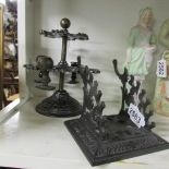 A cast rotating stand for rubber stamps and a cast pen stand.