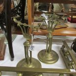 A pair of Victorian brass fire dogs (fire iron rests).