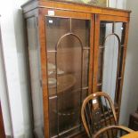 A mahogany display cabinet.