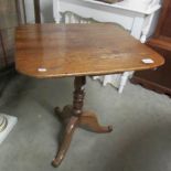 A mahogany tripod table.