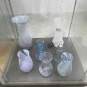 6 various coloured glass vases and a scent bottle.