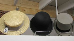 A top hat, a bowler hat and a straw boater.