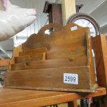 A wooden letter rack.