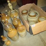 A large box of stoneware jars.