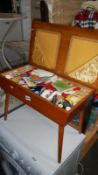 A sewing box and contents