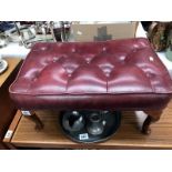 A red leather footstool