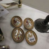 4 miniature oval porcelain plaques.