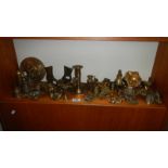 A collection of brassware including chamber candlestick, pair of boot matchbox holders,