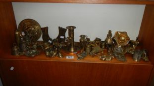 A collection of brassware including chamber candlestick, pair of boot matchbox holders,