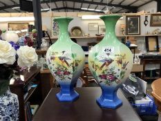 A pair of vases with bird design
