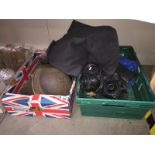 An assortment of military memorabilia including 2 Brodie helmets, gas mask,