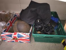 An assortment of military memorabilia including 2 Brodie helmets, gas mask,