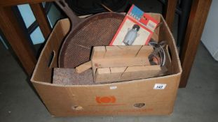 A box of tools, cast iron items etc.