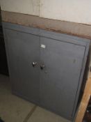 A 2 door metal cabinet