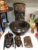 1 large and 3 small wooden masks and graduated set of 3 wooden bowls