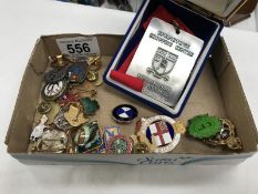 A quantity of assorted badges & a Londonderry marathon medallion