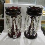 A pair of Victorian ruby glass lustres.