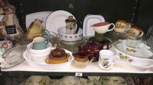 A shelf of kitchenware,