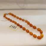 An amber bead necklace.