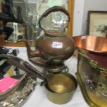 A Victorian copper kettle on stand and 2 Victorian brass sauce pans.