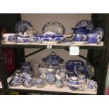 2 shelves of blue and white porcelain with a Capodimonte teapot,