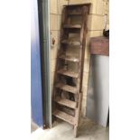 A tall wooden step ladder