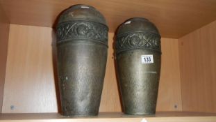An early 20th Century pair of plated brass vases