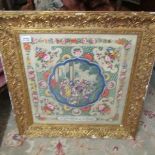 A superb quality framed and glazed Chinese silk group scene with floral border.